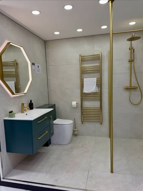 Blue vanity bathroom with brushed gold shower fittings